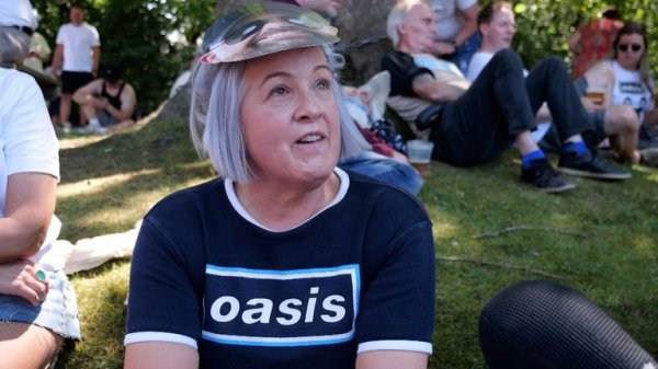 Huge steel fences erected to stop ticketless fans from watching Oasis concert 